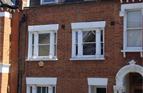 21. Loft conversion with
mansard roof extension and
alterations to house, SW11.