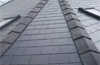 Clay capped ridge on a cement fibre slate roof