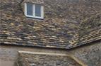Stone tiled roof, swept valley and tiled dormer