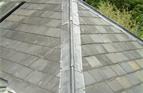 Small Welsh Slate roof with lead roll top ridge & Hips