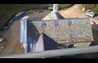 Westmorland slates, conservation roof-lights, lead roll-top ridge, lead-work to valley and pediment.
Welsh slates and clay ridge.