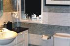 Modern Family Bathroom with wall finished in uPVC cladding.