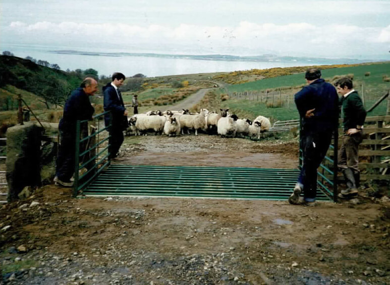 Phil and clients admiring an early edition of the Hopkins Cattle Grid