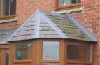 Hipped Porch Roof in Natural Slate, with leaded hips.