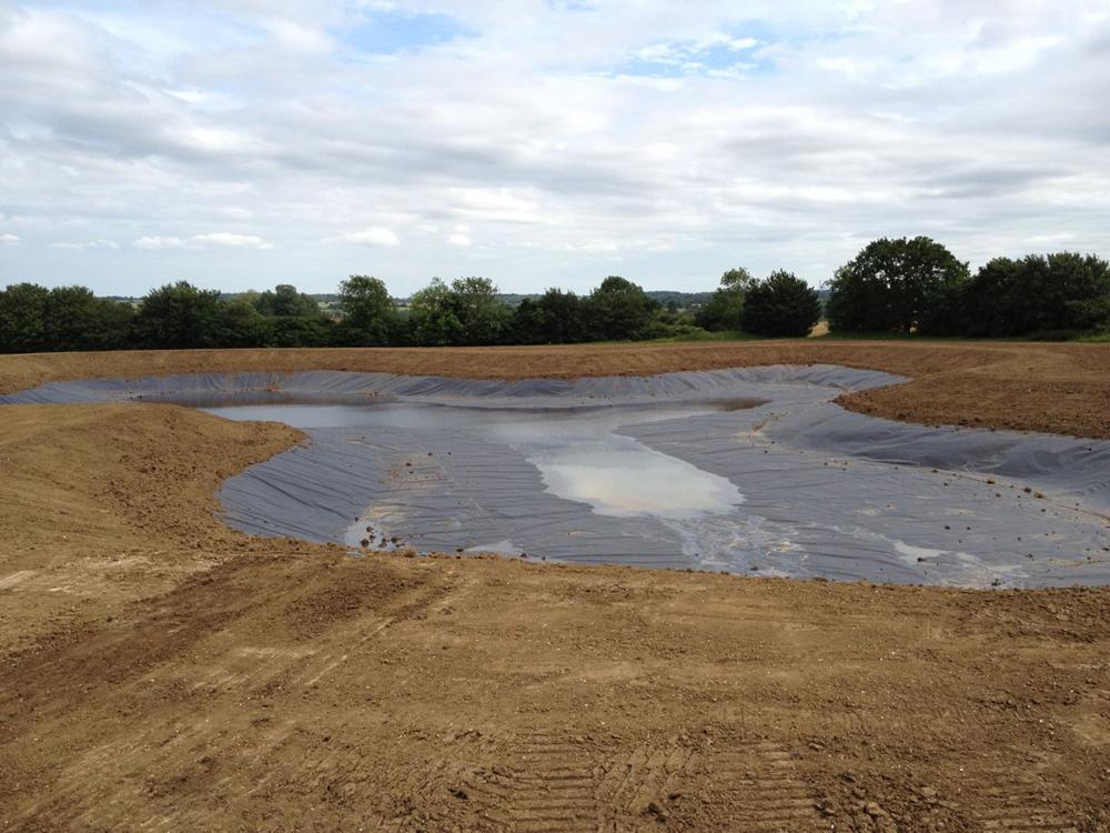 Liner installation finished and topsoiled around perimeter