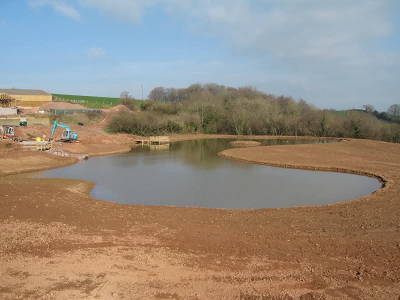 Large lake fitted with a liner and decking in Somerset