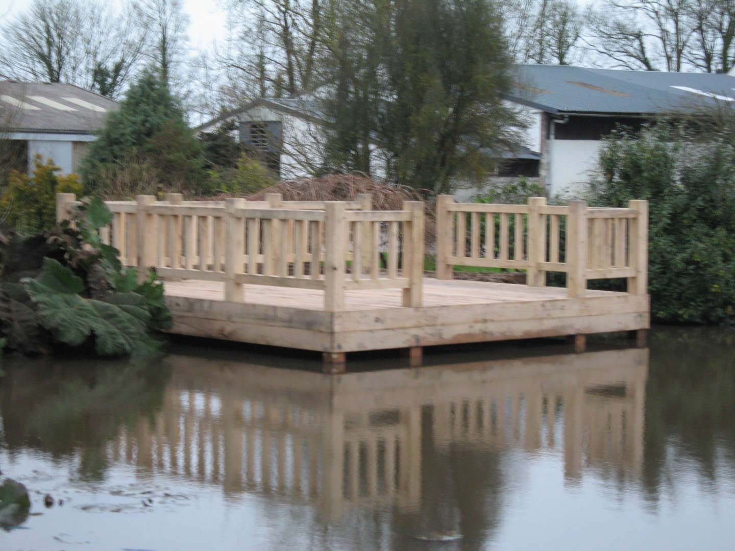 Large Oak cantilevered deck installed on a lake in Devon