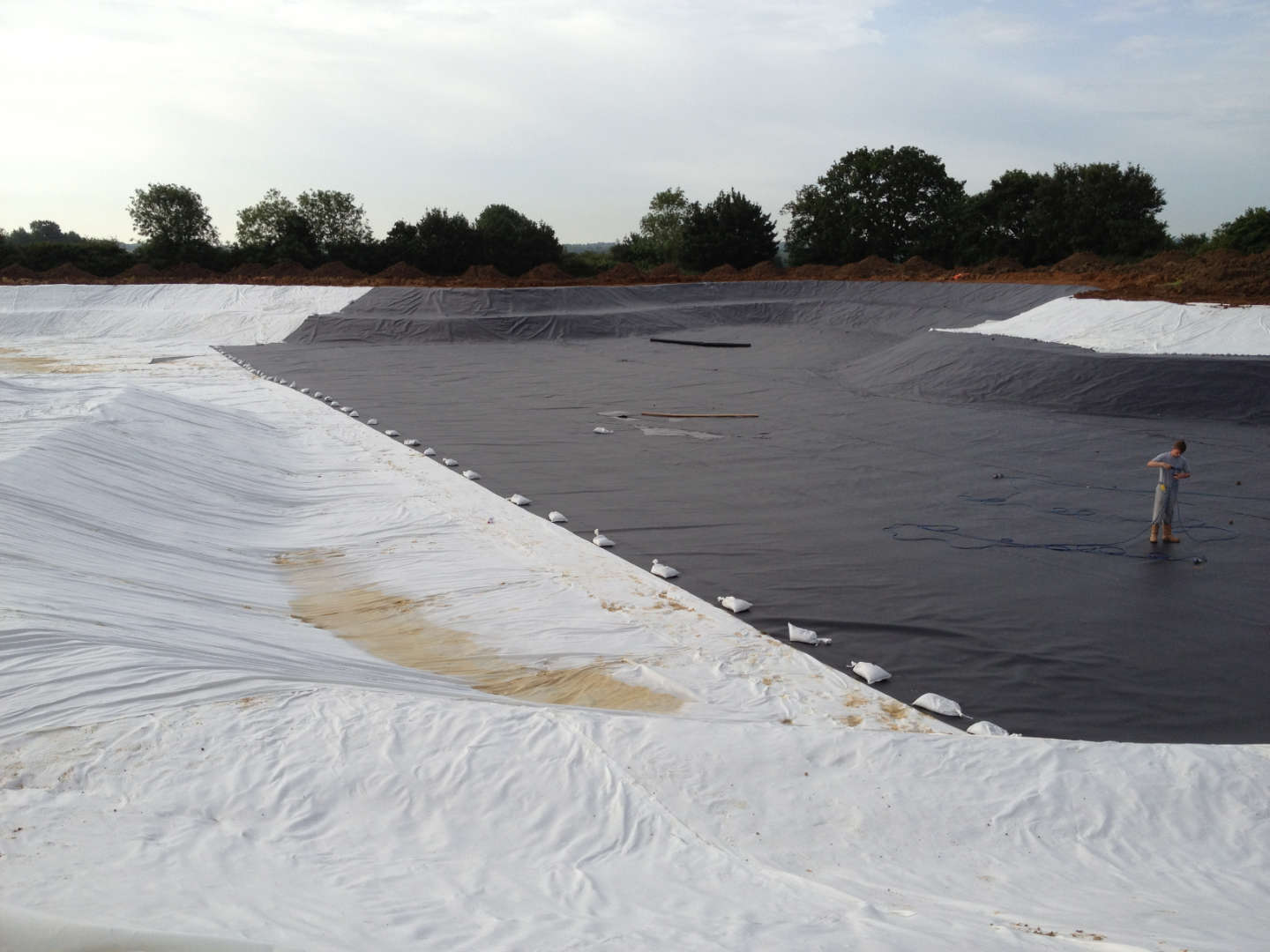 HDPE liner and geomembrane being installed for a Lake project in Cambridgeshire