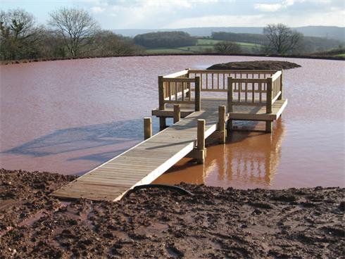 Large timber deck and jetty built on a Lake in Somerset