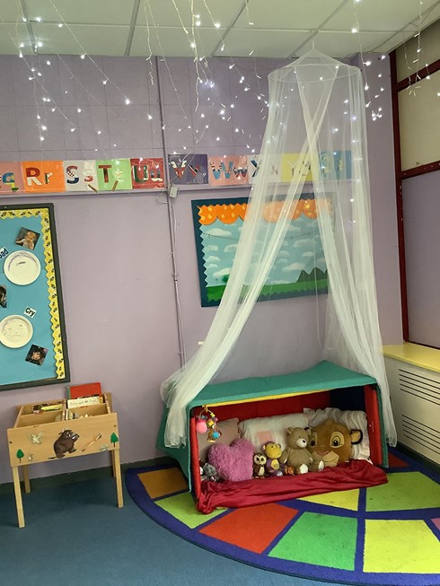 rainbows toddler room soft toys and sleep area