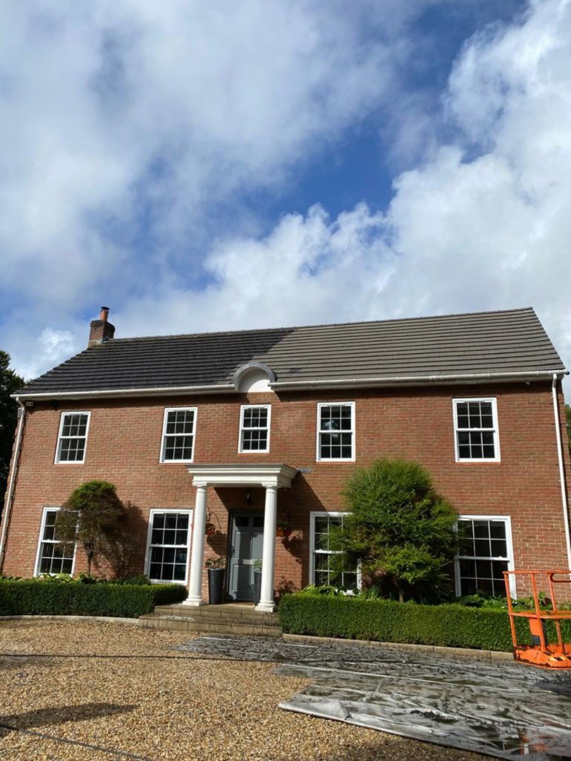Big house half cleaned roof