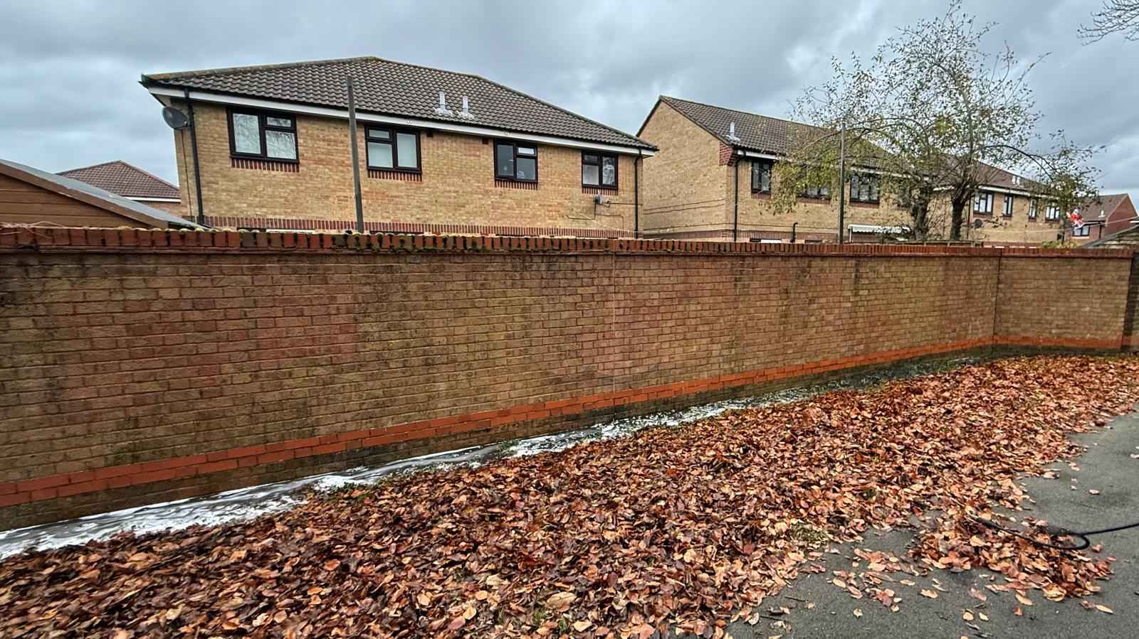 Clean brick fence without graffiti