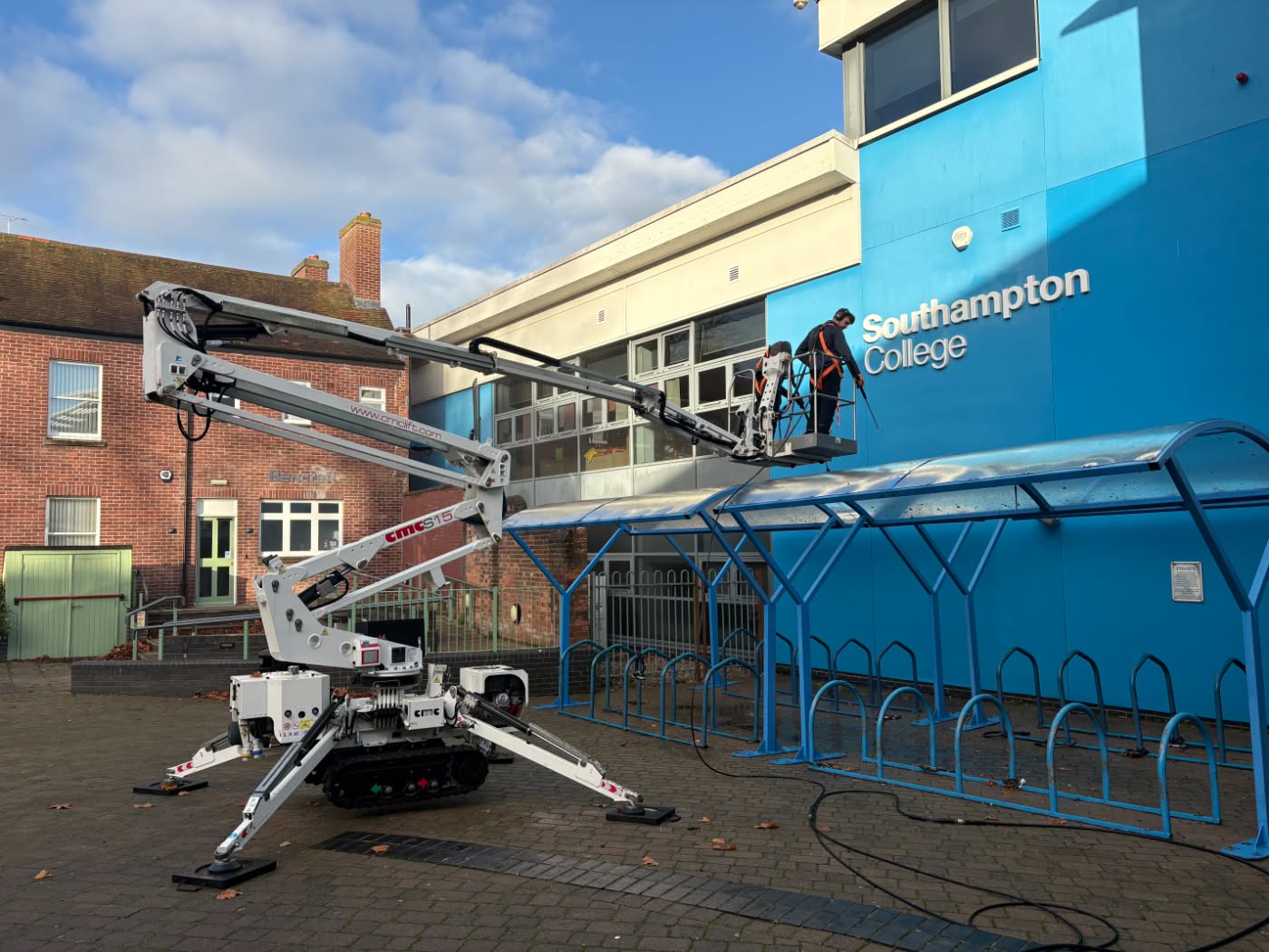 Men jet washing southampton college