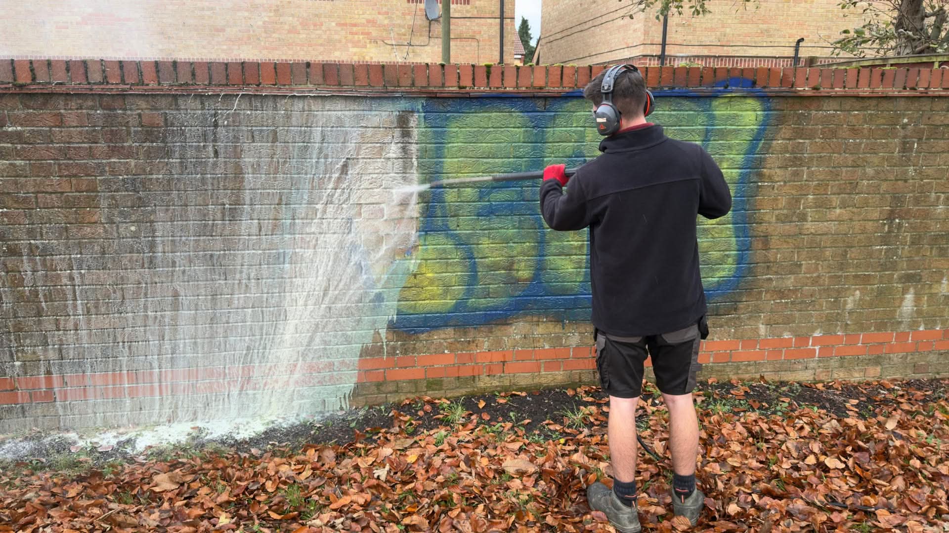 Pressure washing graffiti