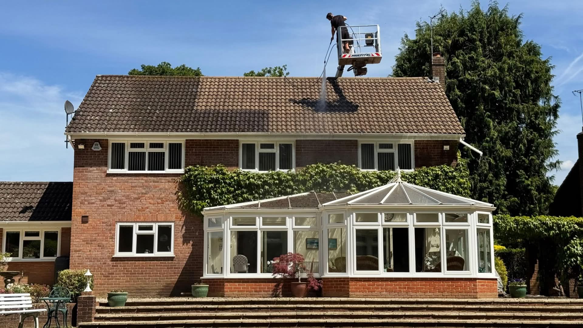 Roof cleaning in progress