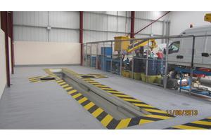 
Mezzanine floor to facilitate office space and large
vehicle pit installation including brake testing equipment.
