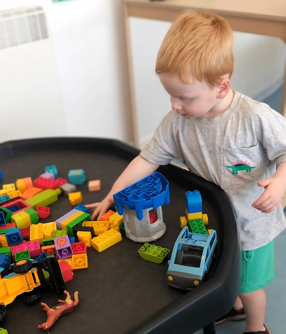 Boy playing with lego