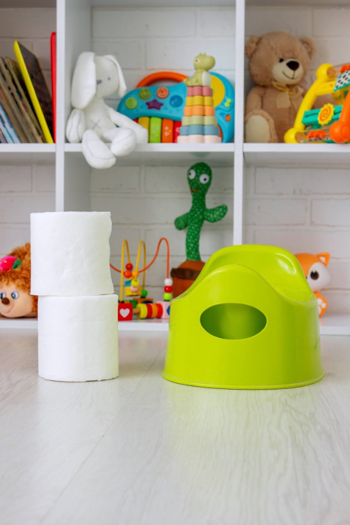 Green potty and toilet paper