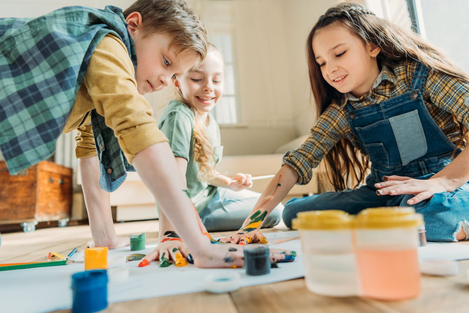 Kids painting on paper