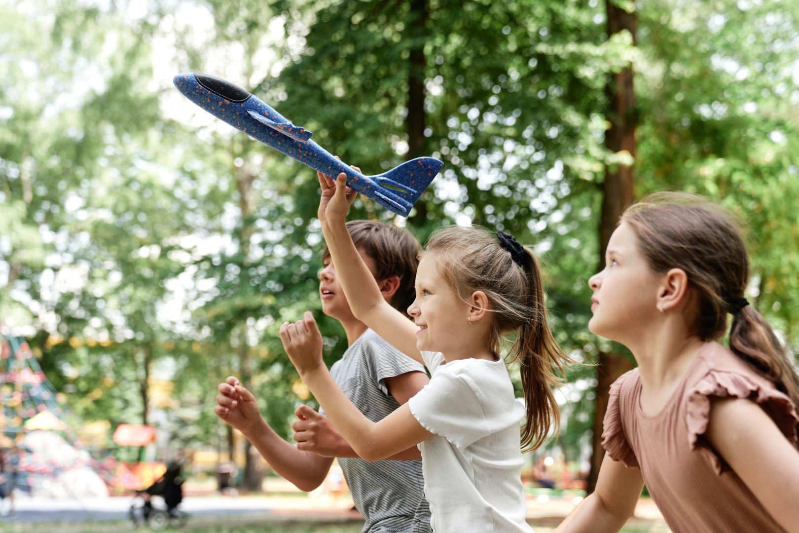 Kids playing together with airplane
