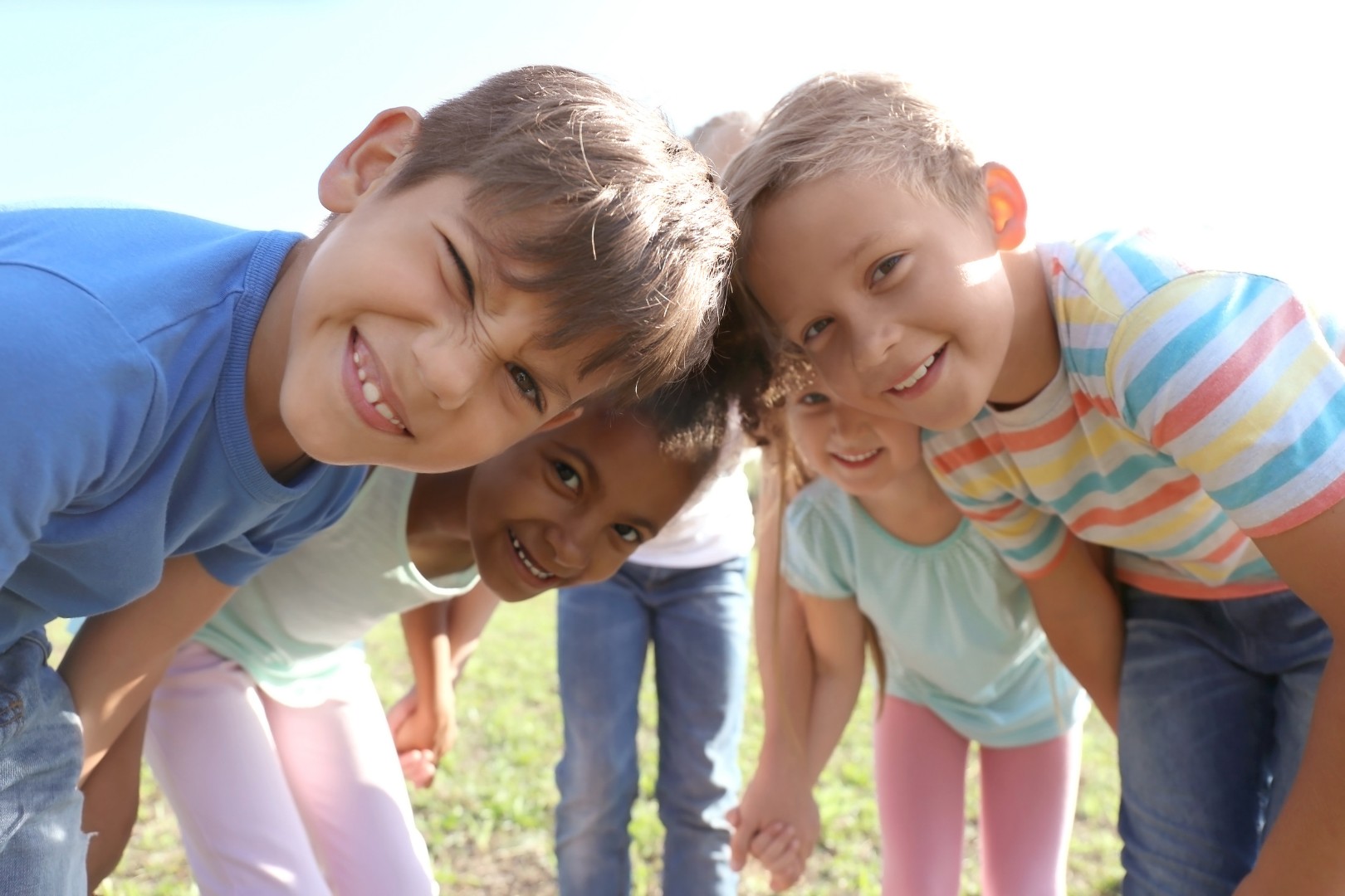 Children huddled round camera