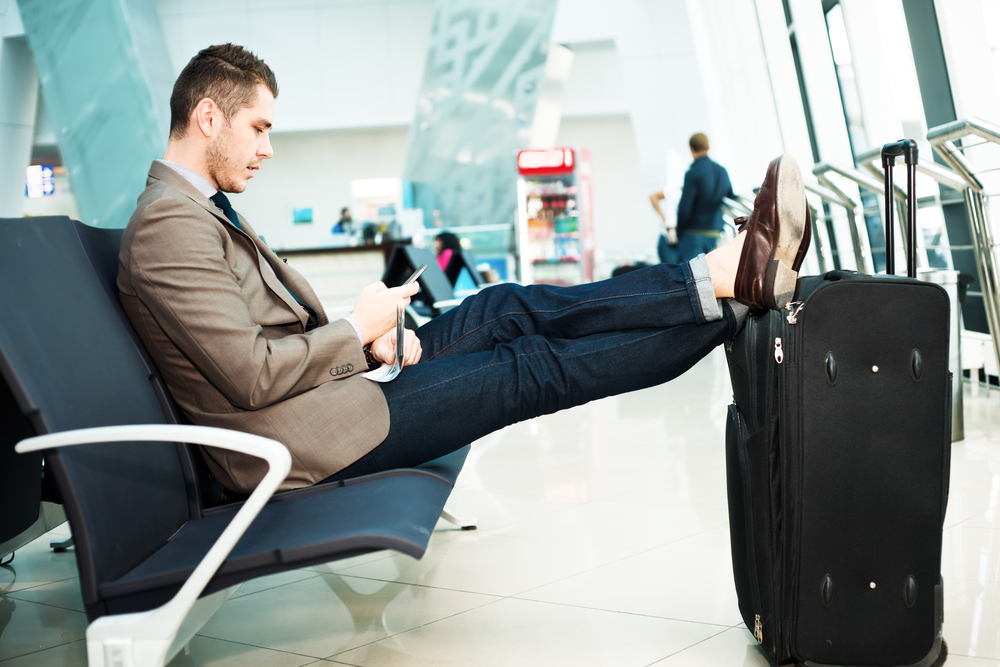 AirportManLookingAtMobile