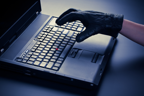 CriminalTypingOnLaptopKeyboard