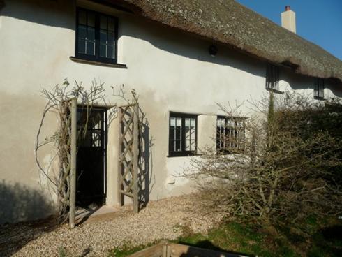 AFTER: A grade one listed cob cottage undergoing repairs. The final result after the traditional lime mortar has been applied