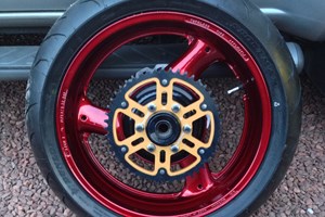 Motorbike wheel refurbished in red lacquer 