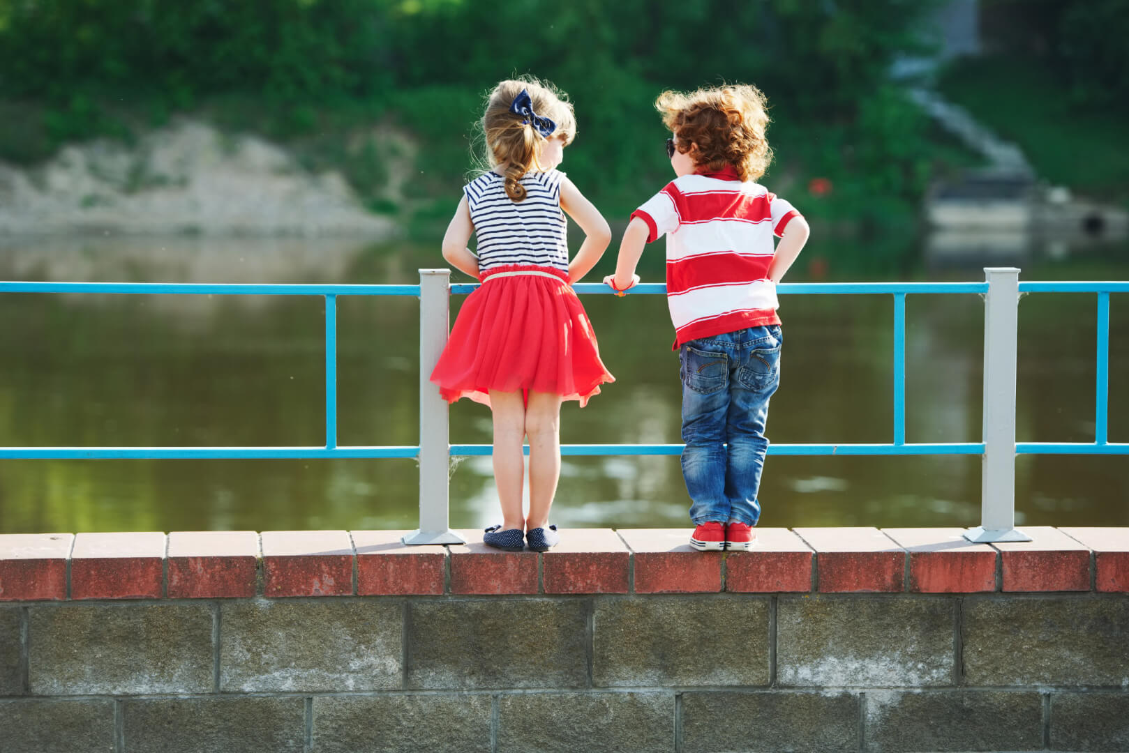 Kids standing on bridge