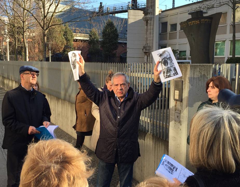 Charles holding posters in berlin