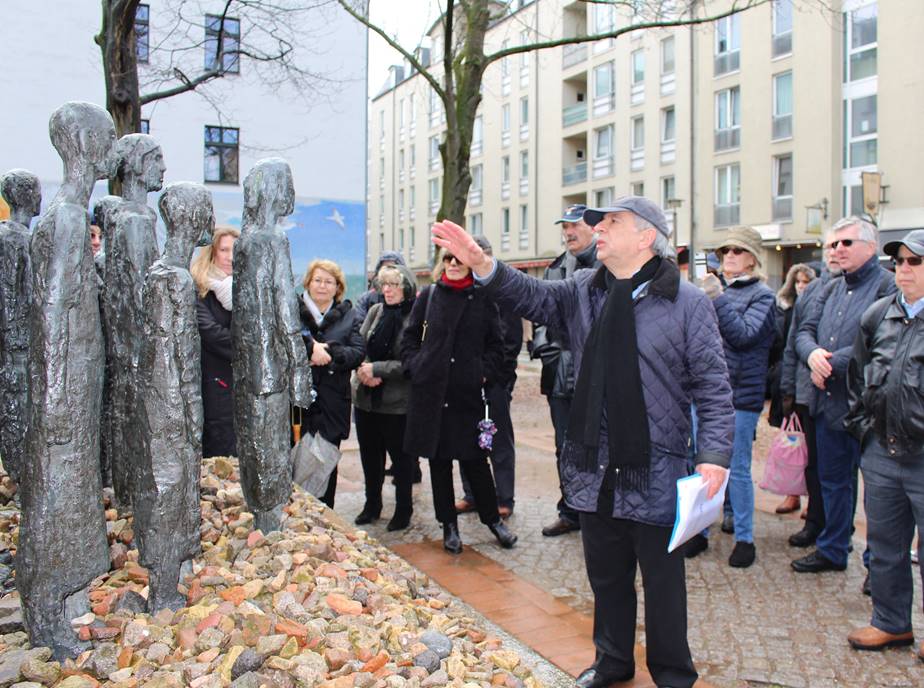 Group looking at statues berlin