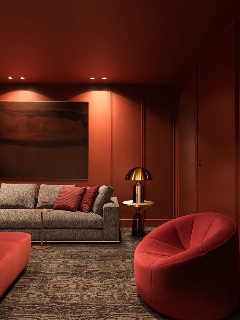 Red living room with gold lamp