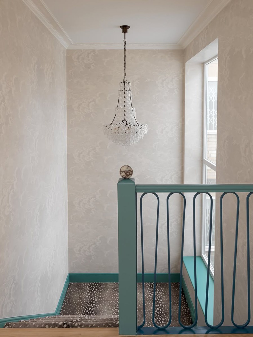 Room with stairs and green railings