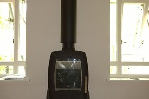 A Stovax, Nordpeis Smarty Stove using a twin wall system on a completely one of a kind hearth in Winchester.