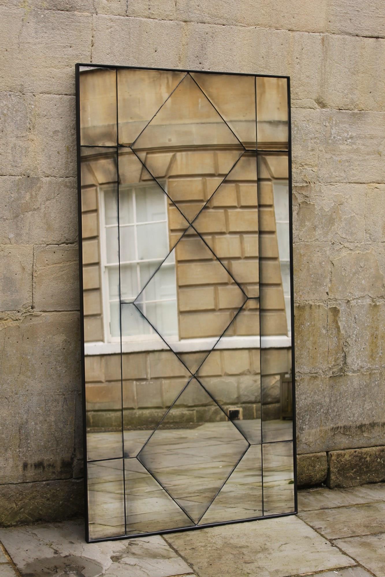Black iron framed Panel Mirror With bespoke antiqued mirror plate.