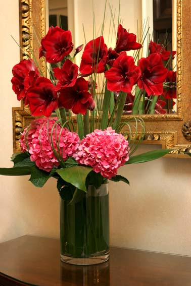 red and pink flowers in vase