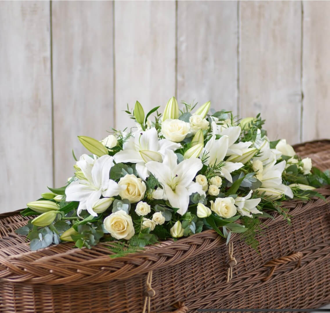 White flowers on woven casket