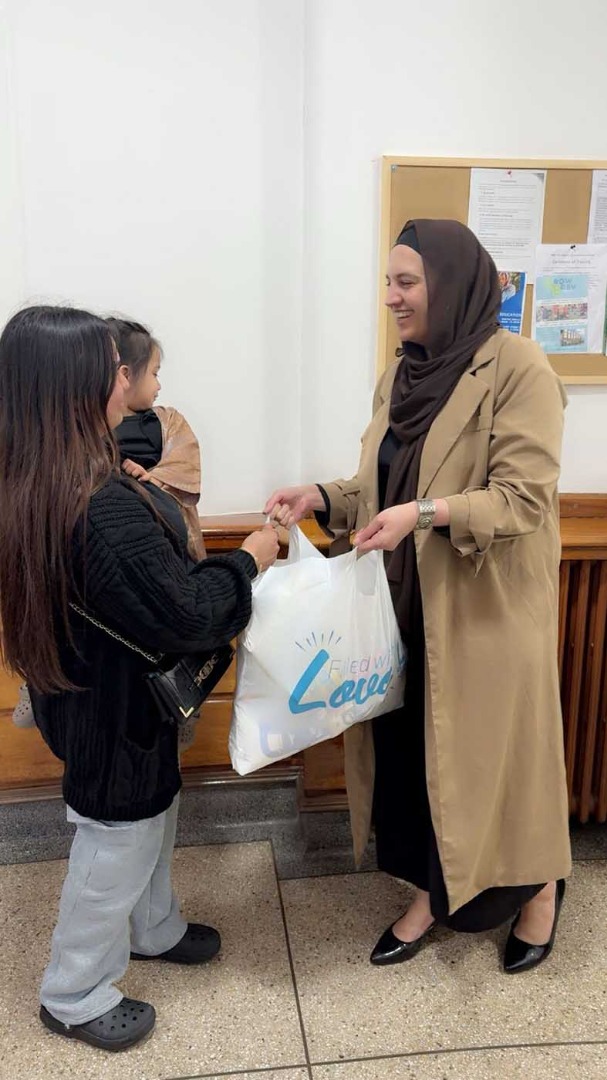 Tenant receving a parcel from team