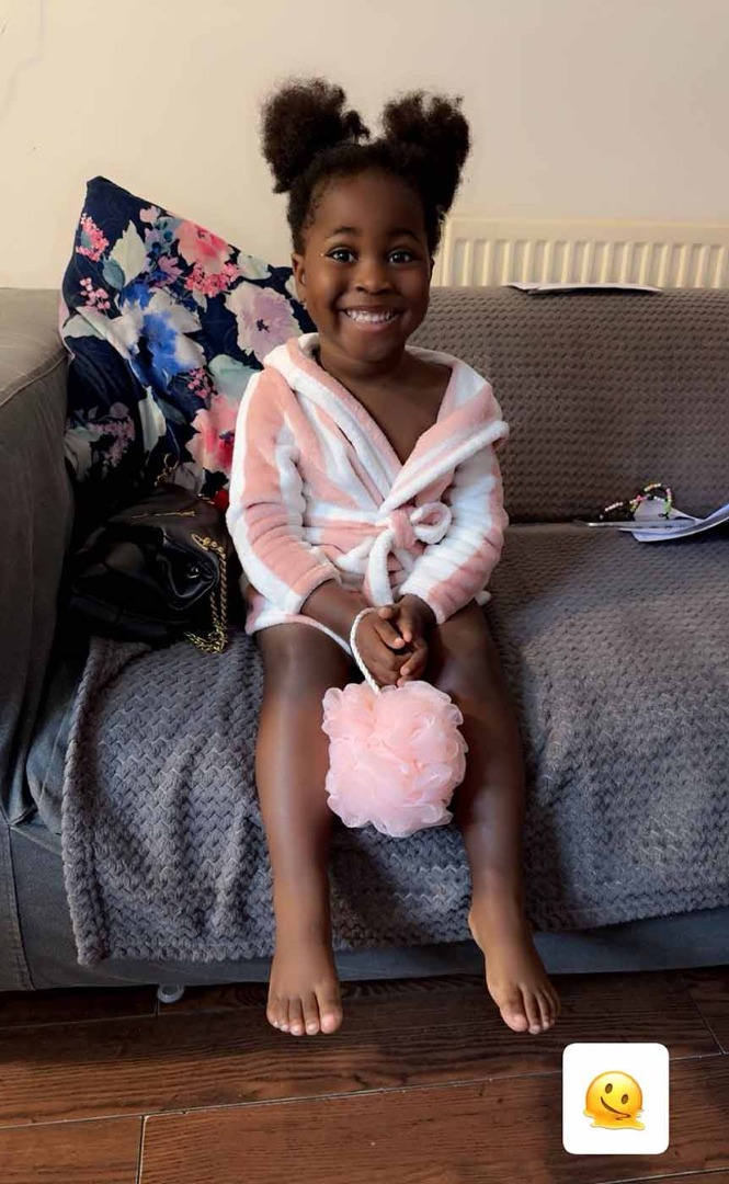 Tenants child happy in her bath gown