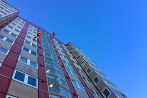 High pressure washing to cladding panels.