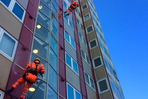 High pressure washing to cladding panels.
