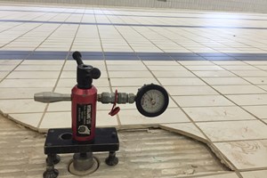 Render pull testing at a swimming pool to determine bond strength