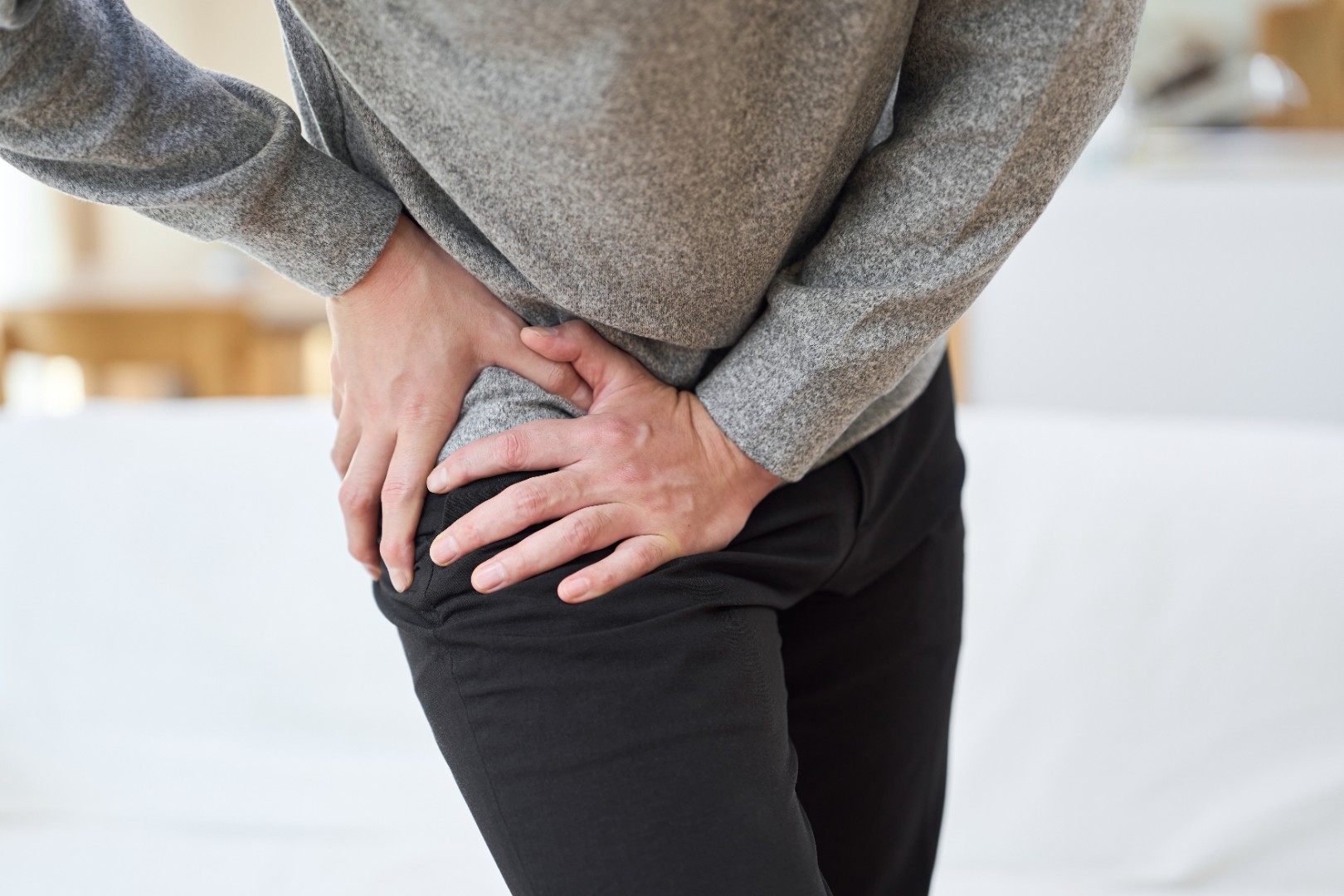 adult experiencing hip pain
