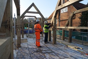 lifting oak trusses into position