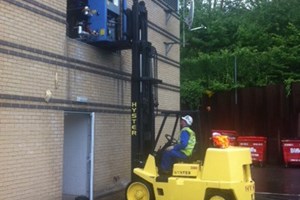 installing a machine through first floor window 