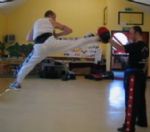 Lee Smalley showing a jumping 
               hood kick