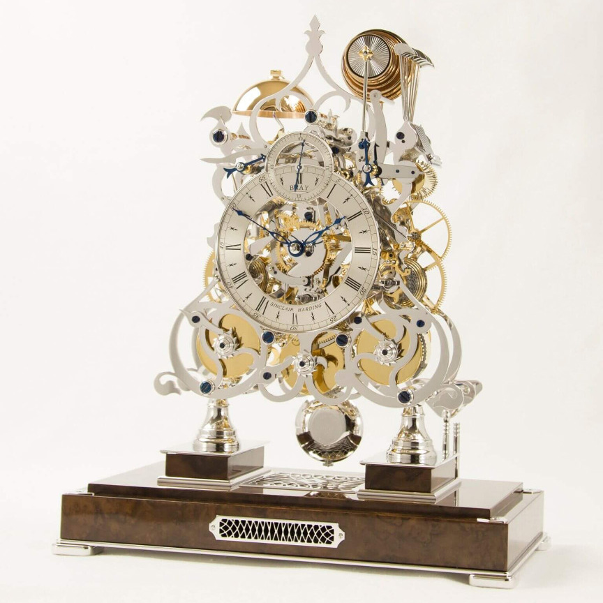 Three train rhodium on walnut