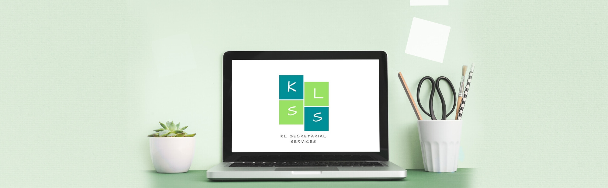 The logo of virtual assistant, Kerry Lummus, displayed on a laptop screen.