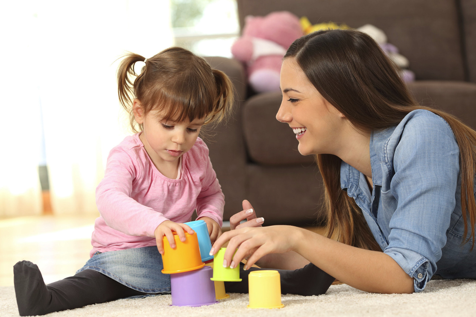 mother playing with young girl